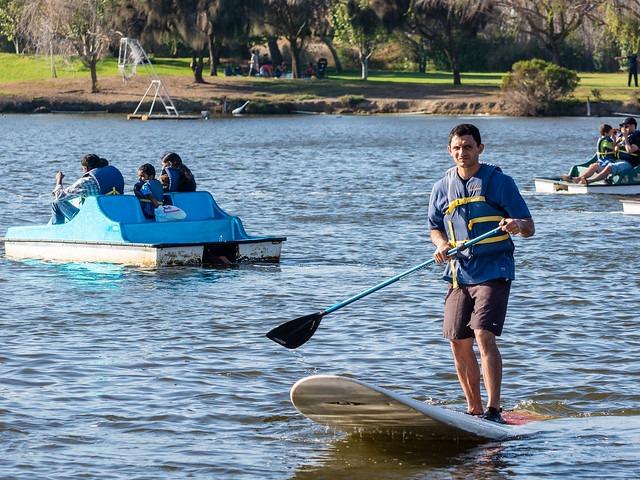 Man on Lake Using Paddleboard